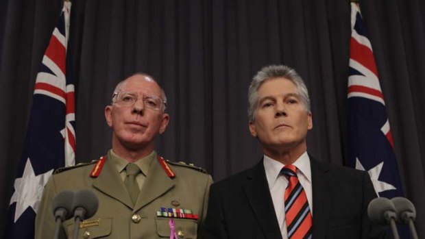To arms ... Defence Force Chief David Hurley and Stephen Smith face the media.