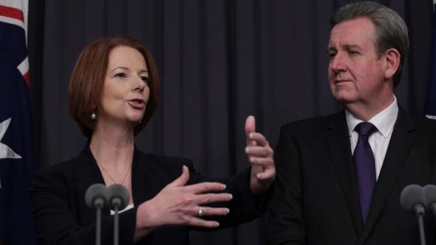 Prime Minister Julia Gillard and NSW Premier Barry O'Farrell at the NDIS press conference in Canberra on Thursday, December 6.
