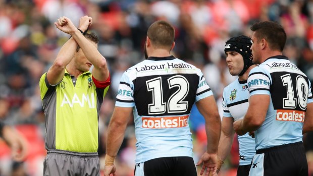 Chris Heighington and Michael Ennis of the Sharks are put on report for a tackle on Jeremy Latimore.