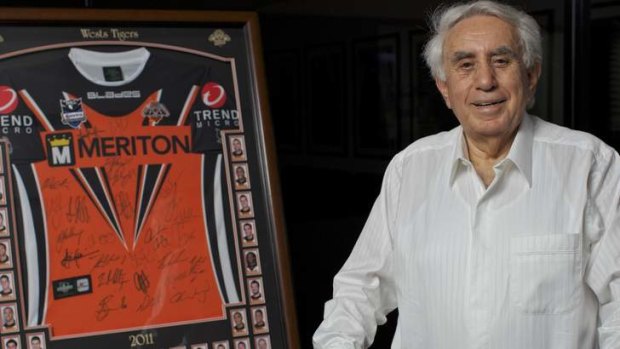 Meriton boss Harry Triguboff has re-signed as Wests Tigers major sponsor.