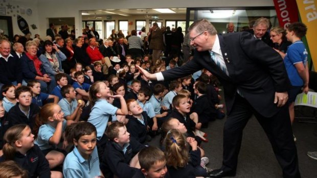 Premier Denis Napthine high fives students at the opening of Woolsthorpe Primary School.