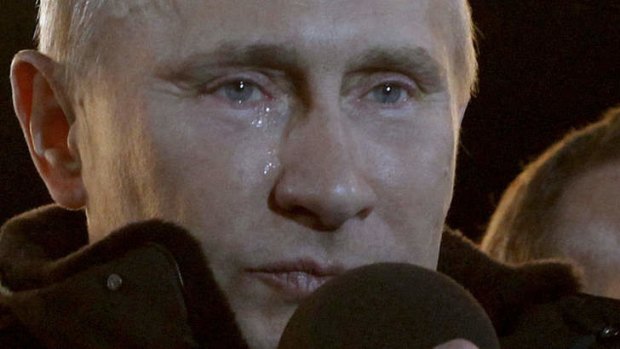 Putin reacts to a massive rally of his supporters at Manezh Square in Moscow.