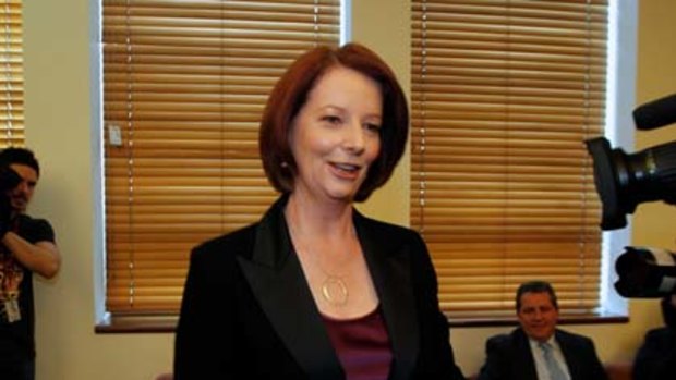 After the air kisses...Prime Minister Julia Gillard during the ALP Caucus room meeting.