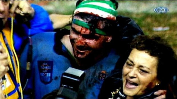 Blood, sweat and tears: A bloodied Benny Elias with mum Barbara after the epic win in 1992.