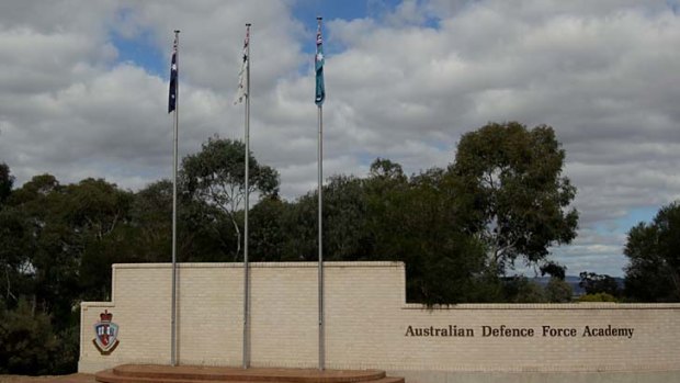 An international student at the Australian Defence Force Academy has been charged with committing indecent acts.