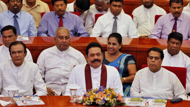 Sri Lankan President Mahinda Rajapaksa with his party members at the launch of his election manifesto in Colombo, on Tuesday.