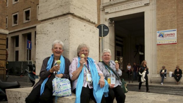 Keeping cool ... Sisters Dorothy Dolahunty, Jenny Riley and Marie Hughes enjoy a gelato in Rome’s Via Conciliazione.