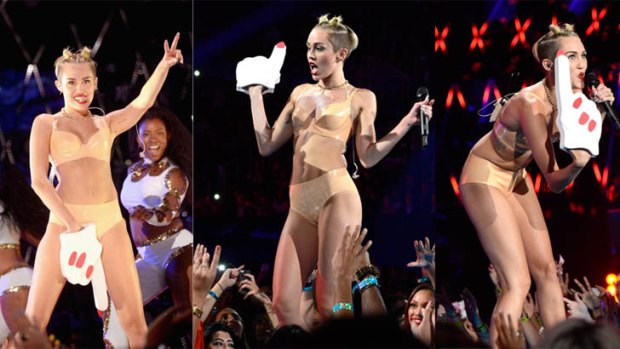In stark contrast ... Miley Cyrus performs during the MTV Video Music Awards.