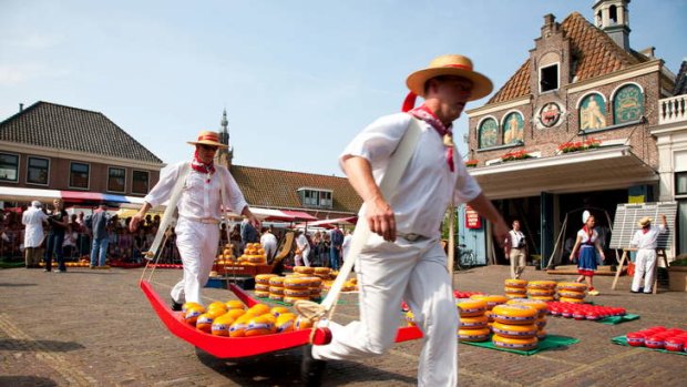 Traditional ... men lay out wheels of cheese for the weekly market in Edam.