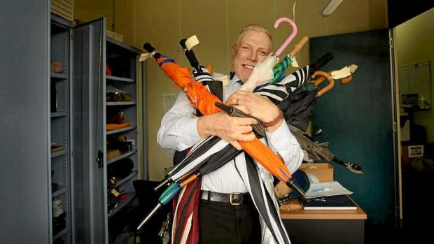 Lost property czar: Hamish Walshe with umbrellas handed into the Willoughby bus depot and which may never go home again.