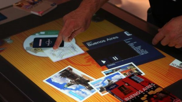 The Lonely Planet application being demonstrated on Microsoft's Surface coffee table computer.