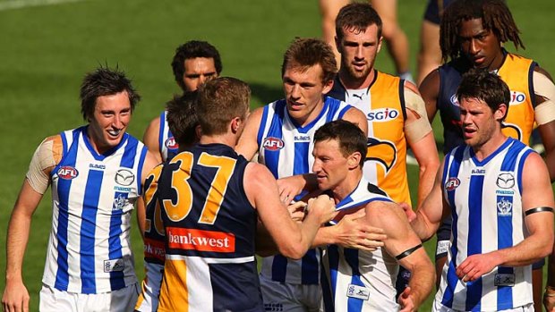 The West Coast Eagles remonstrate with Brent Harvey.
