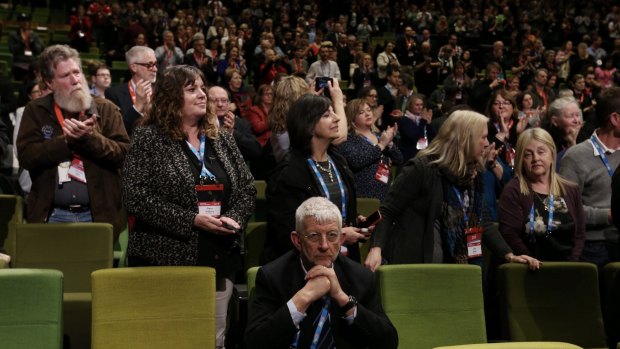 SDA head Joe de Bruyn remains seated as the ALP National Conference gives senator Penny Wong a standing ovation during the marriage equality debate in 2015. 