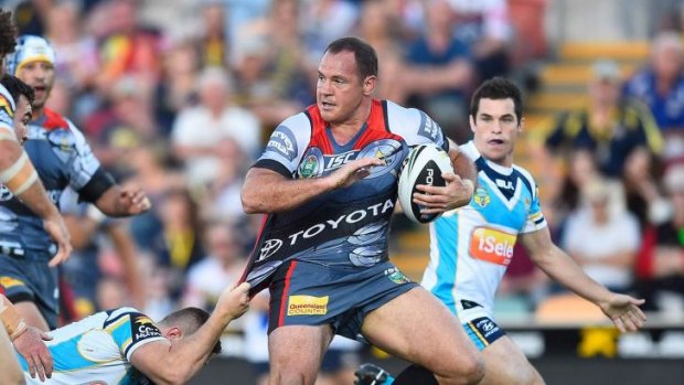 Tough as teak: Matt Scott makes a bust for the Cowboys during their big win over the Titans on Saturday.