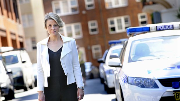 Siren call ... Kristina Keneally stands beside a police car yesterday in Kings Cross where she foreshadowed new Labor law and order initiatives.