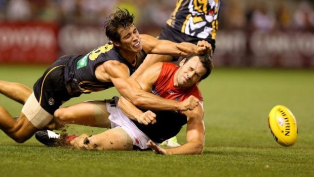 Alex Rance (left), seen here preventing Melbourne's Cameron Pedersen from getting the ball, will miss the game against Carlton.