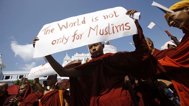 Widespread unrest ... a Myanmar Buddhist monk  takes part in a demonstration against the Organisation of the Islamic Conference in Yangon, Burma.