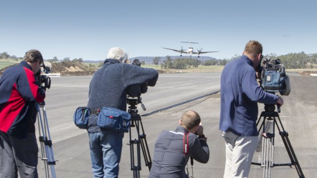 The first aeroplane with Queensland Premier Campbell Newman lands  at Brisbane West Wellcamp Airport. 