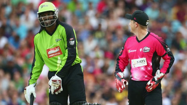Chris Gayle of the Thunder and Brad Haddin of the Sixers share a laugh during a Big Bash match.