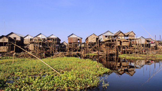 Village people ... houses on the Tonle Sap.