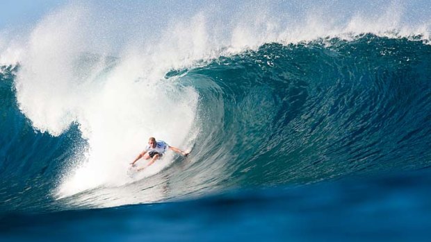 Under pressure: Australian Mick Fanning at the Pipe Masters this week. He has to survive a clash with CJ Hobgood to stay in the event.