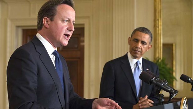 Support: David Cameron and Barack Obama address the media in Washington on Monday.