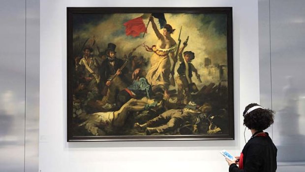 What is this? A woman looks at a Eugene Delacroix 's painting.
