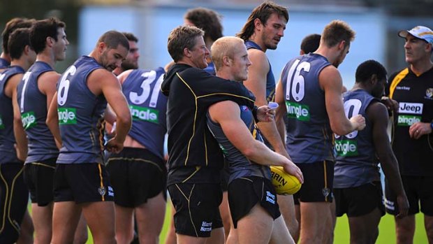 Come here: Coach Damien Hardwick with Steven Morris at Richmond's training session on Tuesday.