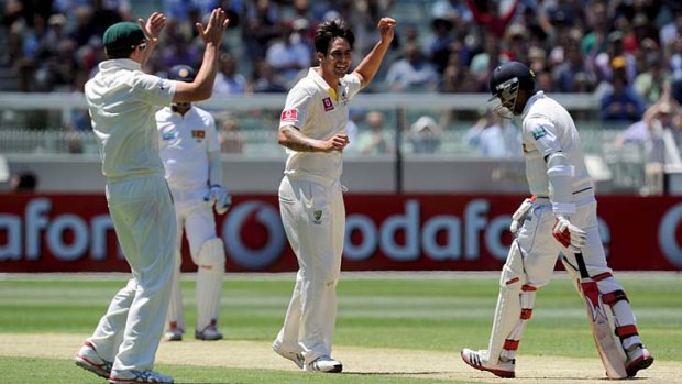 Too easy &#8230; recalled paceman Mitchell Johnson sees off Dhammika Prasad at the MCG on Wednesday.