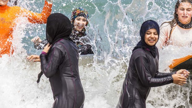 Wearing water hijabs, students (from left) Maida Kanwai, Fereshtah Mohammadi and Aisha Shahbazfetes take to the water.
