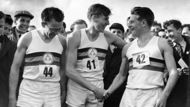 Sir Chris Chataway (R) congratulates Roger Bannister (C) after helping him break the four-minute mile at Oxford in 1954.