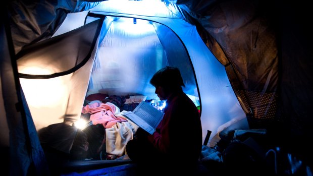 The young homeless woman who is studying year 11 at RMIT in her tent.