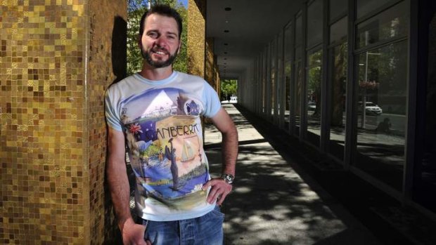 Aaron Chandler shows off his vintage Canberra T-shirt.
