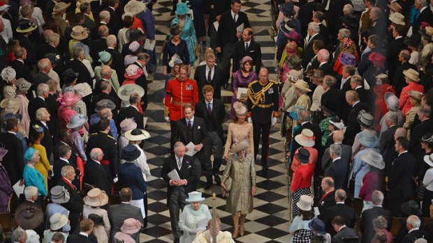 London thanksgiving ... the Queen, followed by members of the royal family, leave St Paul's Cathedral after yesterday's Diamond Jubilee service.