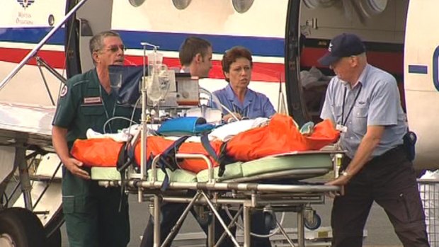 A Royal Flying Doctor Service plane carrying one of the critically injured children lands at Perth Airport.