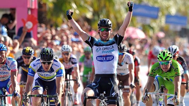 Britain's Mark Cavendish celebrates as he crosses the finish line to win the sixth stage of the Giro d'Italia, from Mola di Bari to Margherita di Savoia.