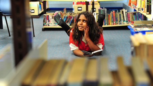Yulcaila Hoolihan-Mongta, 11, of Forrest Primary School in Canberra, participates in the Indigenous Reading Project, using a Kindle to boost her reading skills.