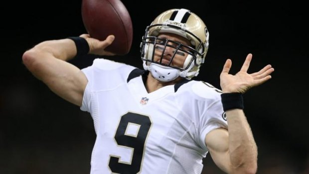 Drew Brees of the New Orleans Saints warms up before the preseason game against the Baltimore Ravens.
