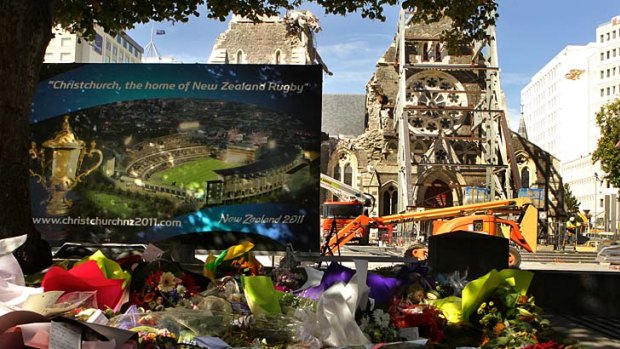 Flowers and messages from the loved ones of the earthquake victims lay in front of Christchurch Cathedral building. Christchurch.
