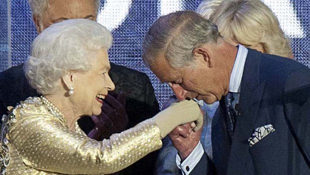 Prince Charles kisses the hand of his mother, Queen Elizabeth, at the end of her Diamond Jubilee concert.
