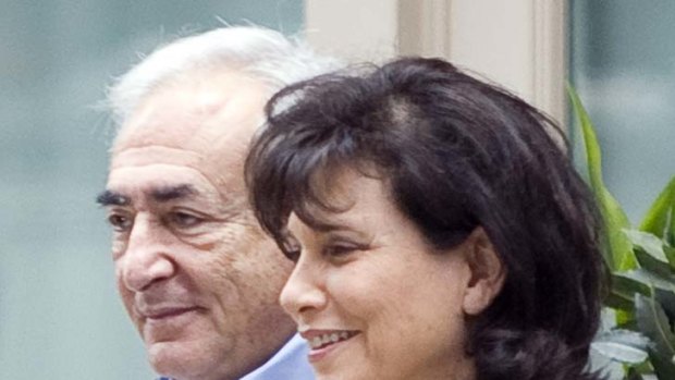 Liberty ... Dominique Strauss-Kahn with his wife in New York.