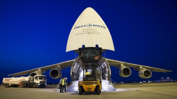 Heavy lift: Military equipment from Germany bound for Iraq is loaded onto a giant carrier plane at Leipzig/Halle Airport on Thursday.