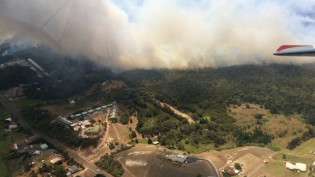 Firefighters were working to combat a blaze that breached containment lines at Williamtown, just north of Newcastle.
