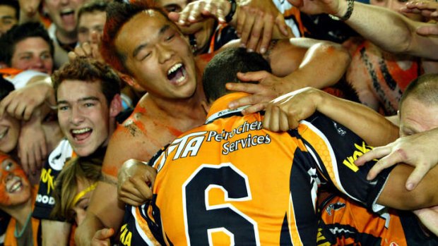 From this: Benji Marshall celebrates the Tigers' 2005 premiership triumph.
