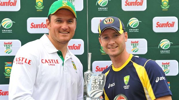 Captains Graeme Smith of South Africa and Michael Clarke of Australia hold the trophy after a two-Test series in South Africa last year.