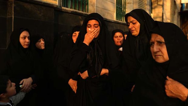 Mourning: Reza Barati's sister Kowsar (fifth from left) with her aunt (second from right) after the memorial service.
