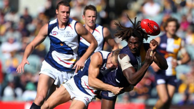 West Coast ruckman Nic Naitanui gets his handball away.