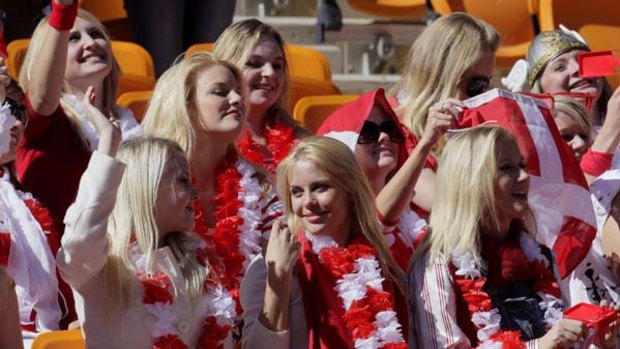 The women were dressed as Danish supporters before stripping off to reveal orange miniskirts.
