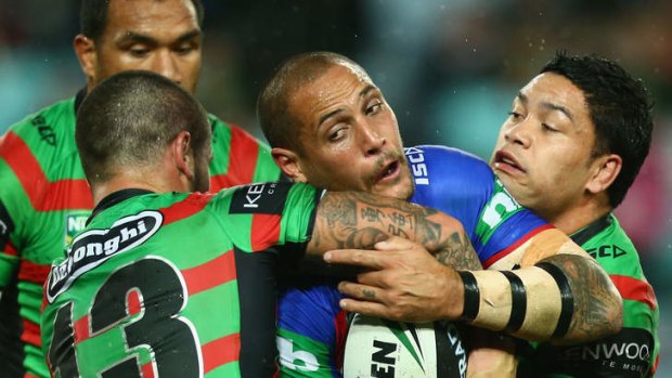 Going nowhere: Newcastle's Jeremy Smith is tackled by South Sydney during a match earlier this month.