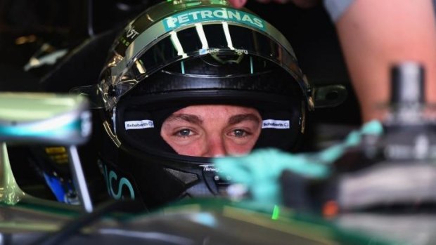 Nico Rosberg sits in his car in the team garage during practice ahead of the British Formula One Grand Prix at Silverstone Circuit on Friday.